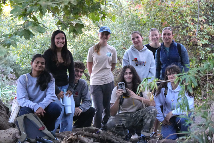 Youth Council members with a camera trap in Conejo Valley open space