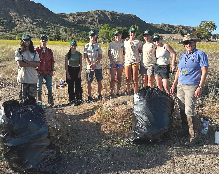 Youth Council members with bagged invasive material at Wildwood Regional Park