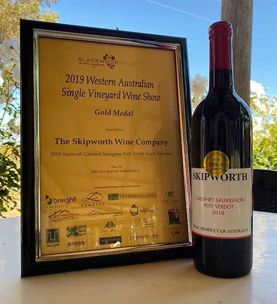 Gold medal certificate from the Western Australian Single Vineyard Wine Show next to the winning bottle of The Skipworth Wine Company Cabernet Sauvignon / Petit Verdot 