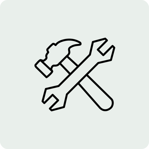 Outline drawing of a hammer and a screwdriver crossed over each other.