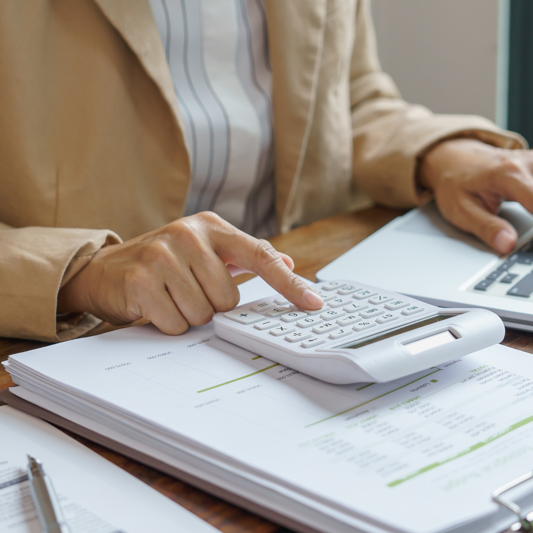 Benefits professionals reviewing plan design costs and data to deliver people-centered benefit solutions