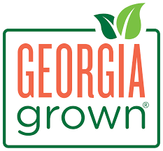 Georgia Grown logo with green and orange text and two green leaves.