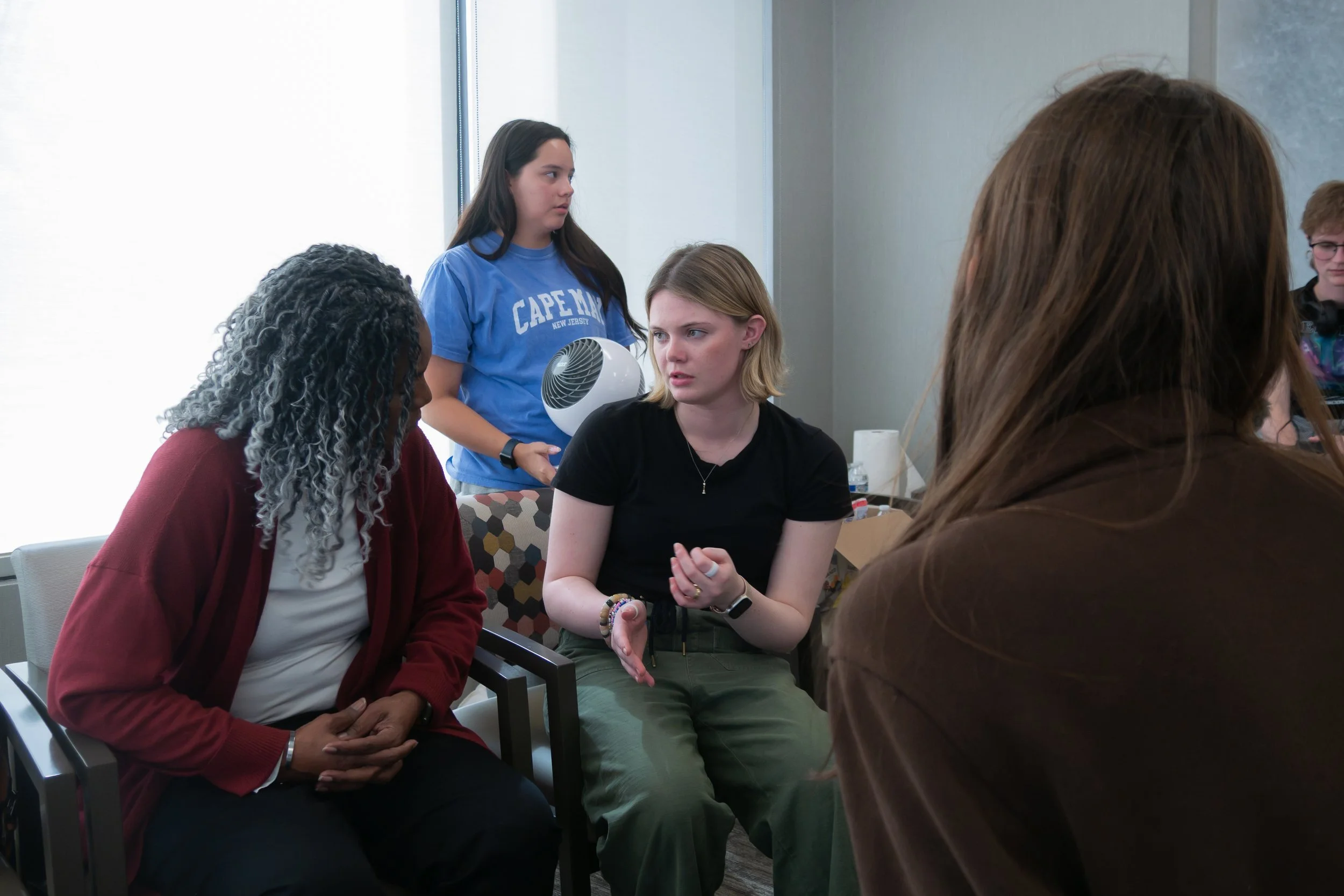Ryan Garner and Jamie Eckhoff preparing actors behind the scenes during the filming of Waiting Room, a film by Good Fortune Pictures