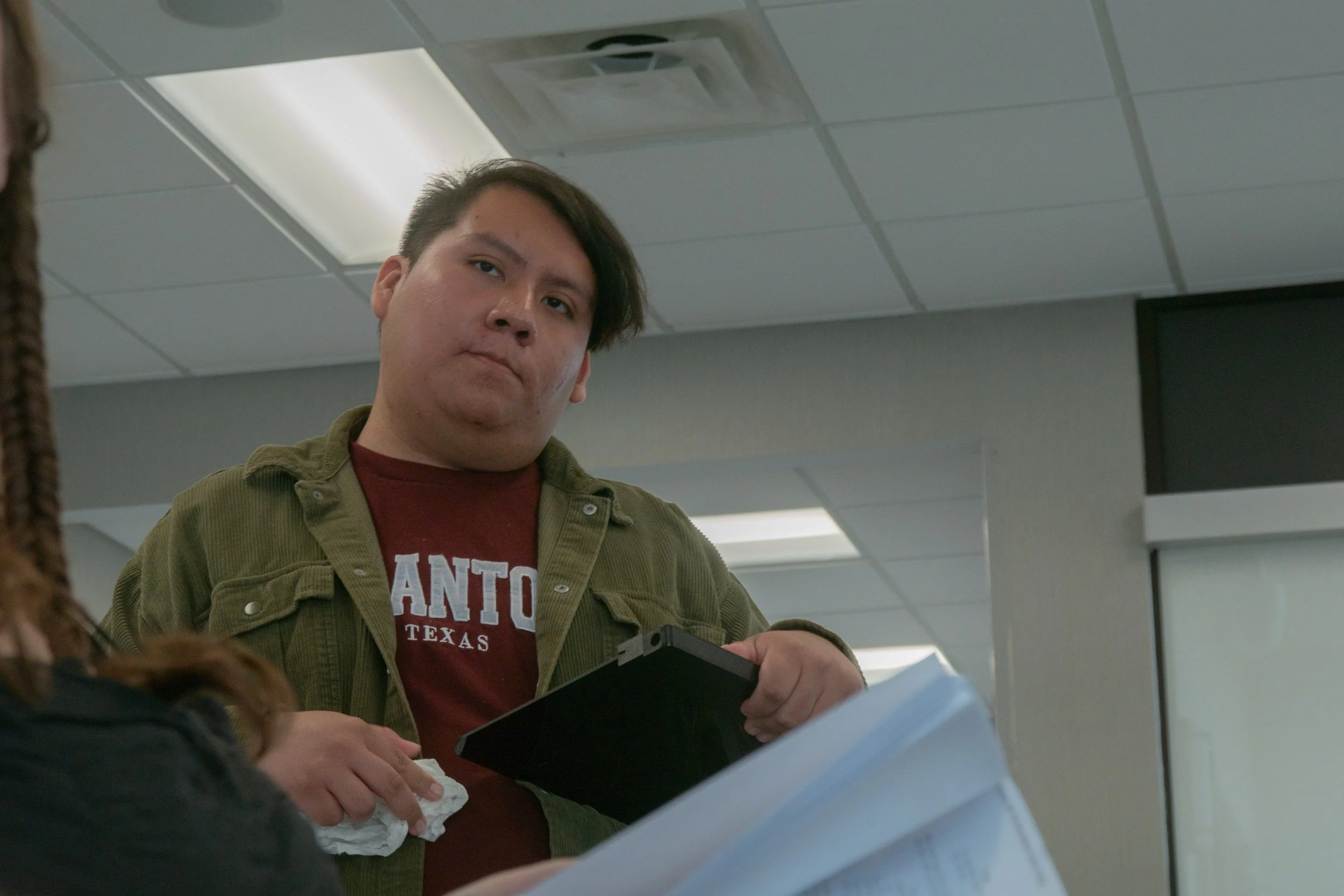 Producers preparing the slate behind the scenes during the filming of Waiting Room, a film by Good Fortune Pictures