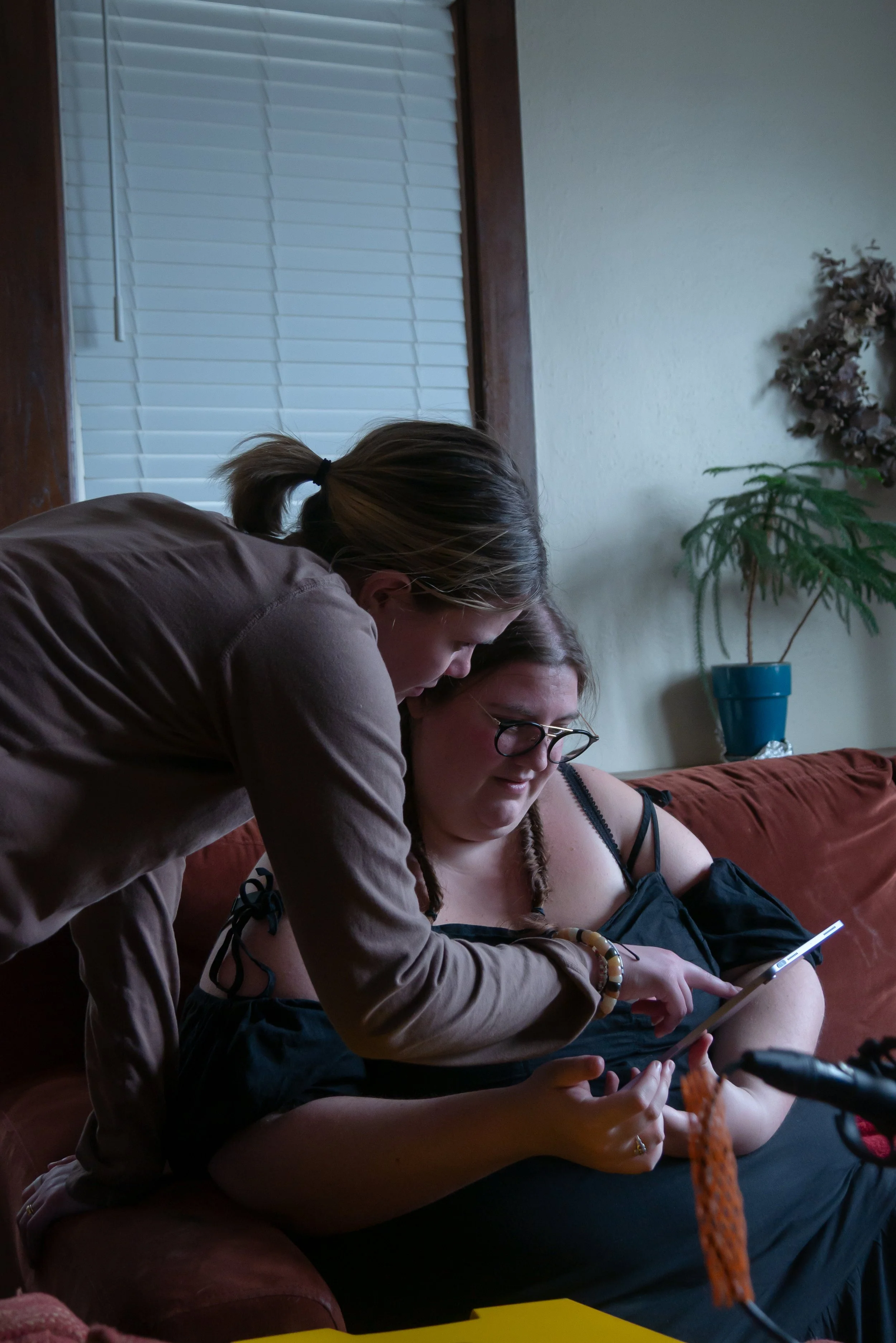 Ryan Garner and Jamie Eckhoff reviewing notes and script behind the scenes during the filming of Waiting Room, a film by Good Fortune Pictures