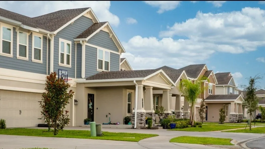 Pine Glen neighborhood in St. Cloud FL — new construction homes, community streets, and growing residential area.