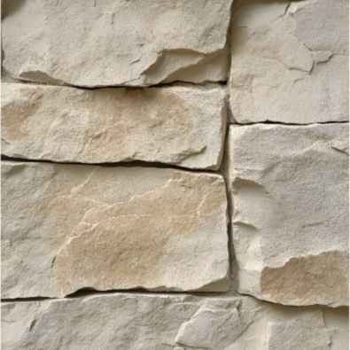 Close-up of natural stone masonry with layered beige tones and visible mortar lines.