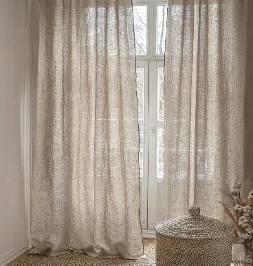Light-filled interior with sheer curtains, natural textures, and soft neutral tones, reflecting Imagine Homes’ thoughtful design approach.