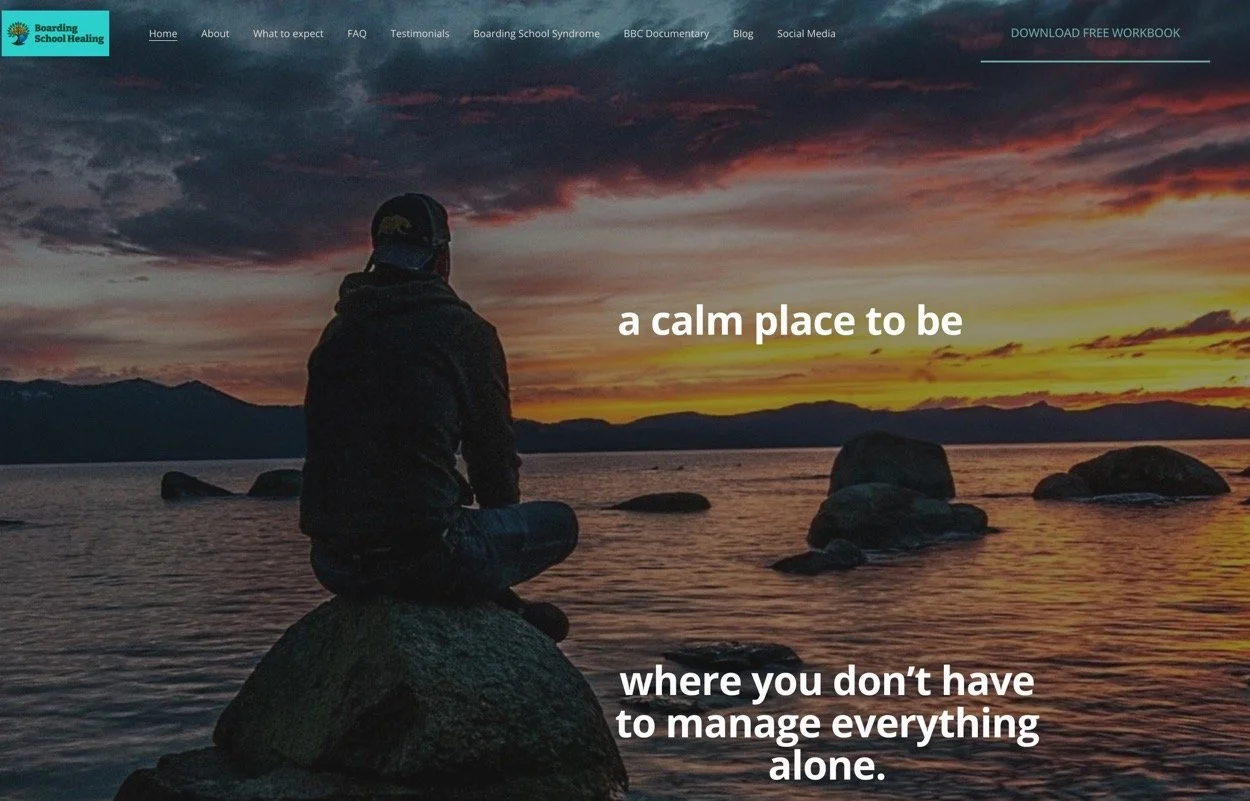 A person sitting on a rock by a body of water during sunset, with dark clouds and mountains in the background. The webpage overlay includes the text: 'a calm place to be where you don't have to manage everything alone.'