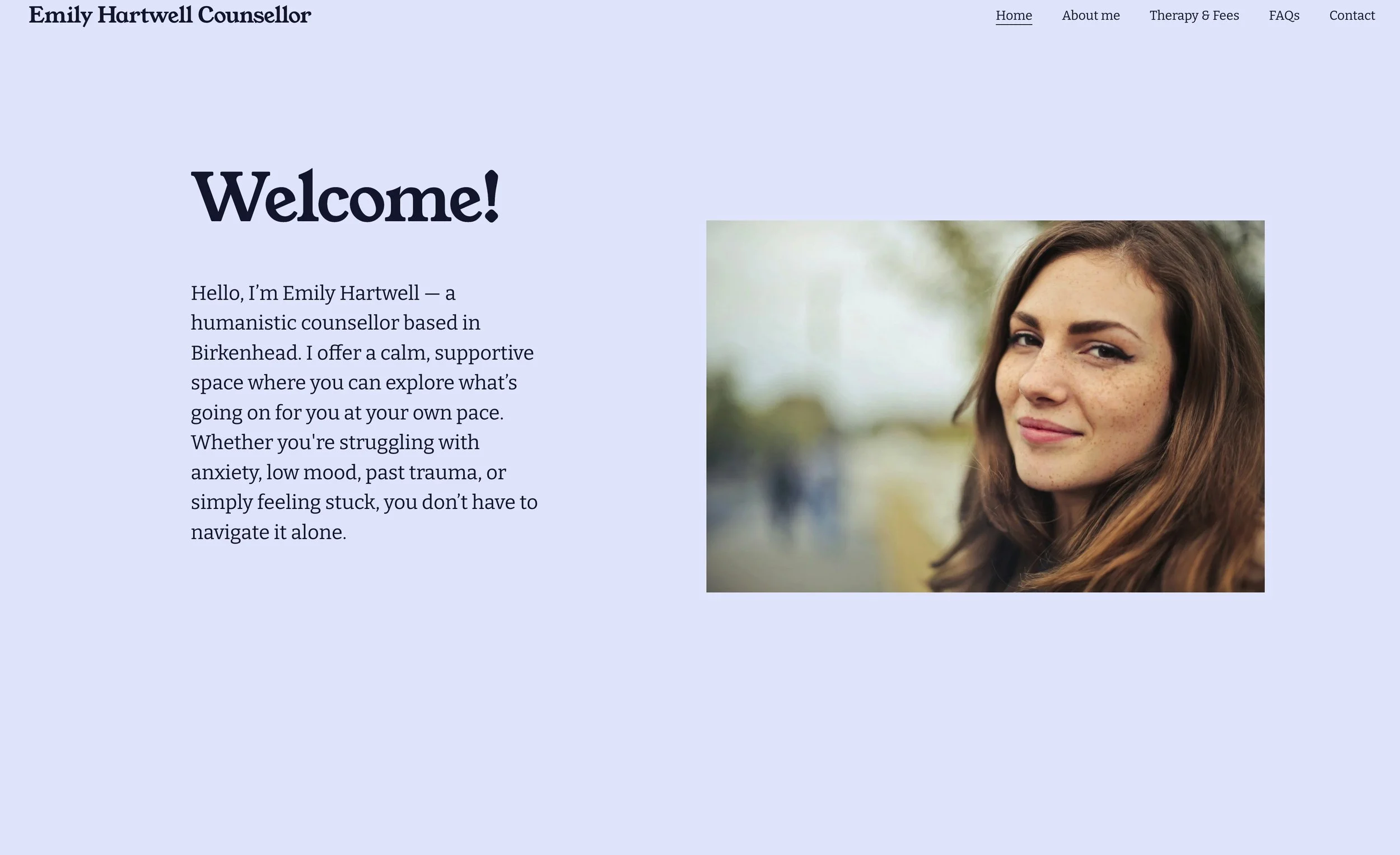 Screenshot of a therapist's homepage featuring a welcome message and a portrait of a woman with brown hair, outdoors, with a light purple background, a navigation menu at the top including links to Home, About me, Therapy & Fees, FAQs, and Contact.