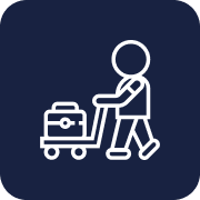 Icon of a person pushing a luggage cart with a suitcase on it.
