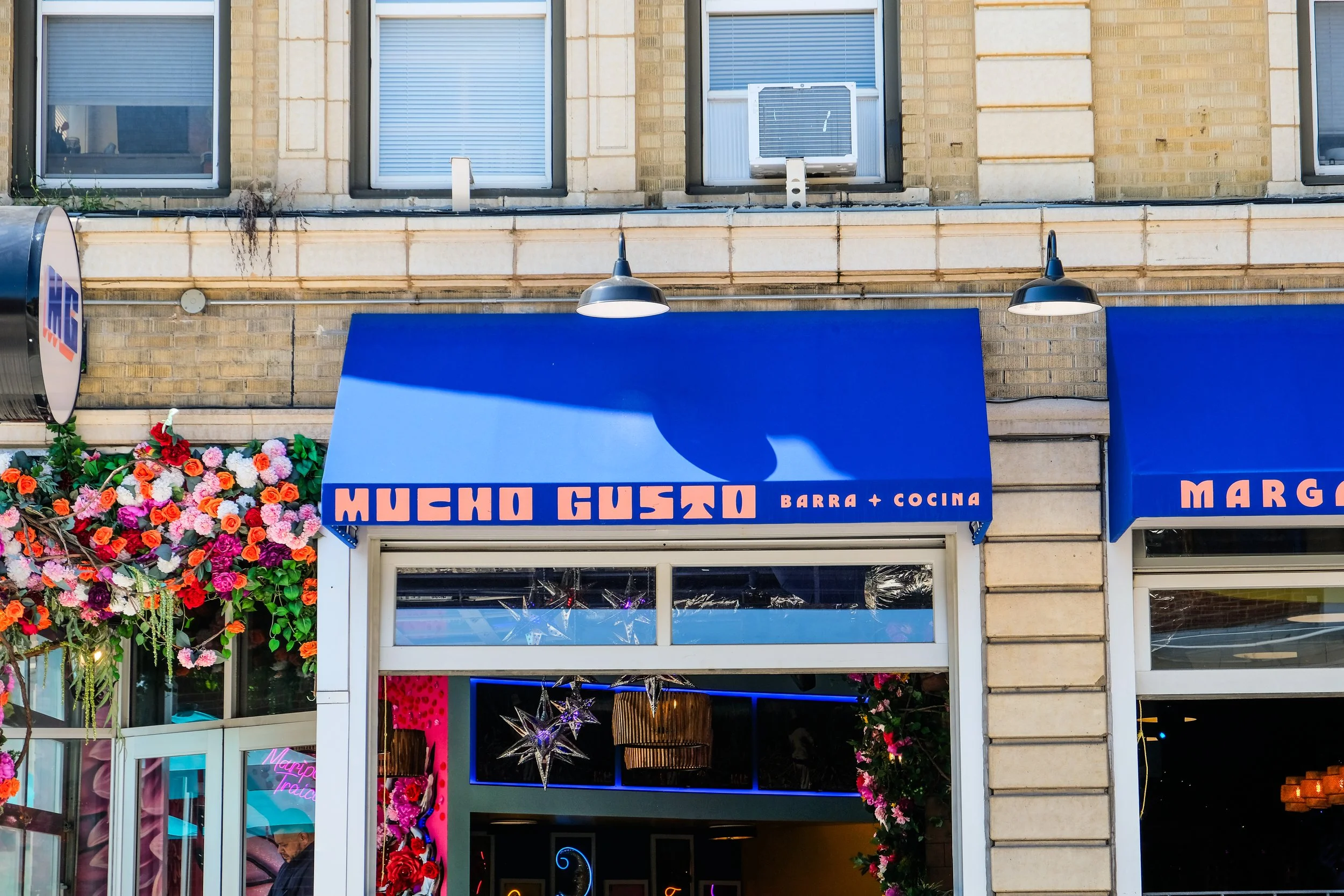 Mucho Gusto's blue awnings with pink letters