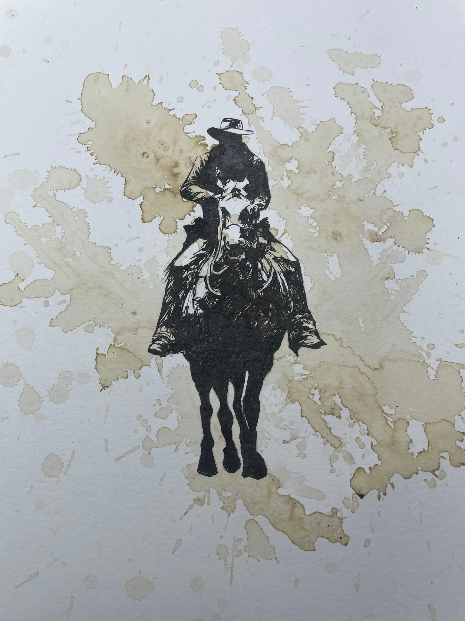 A black-and-white drawing of a cowboy riding a horse with splashes of brown ink in the background.