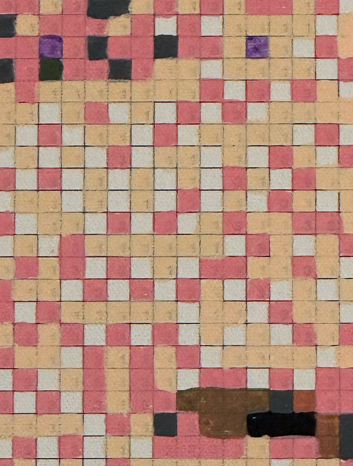 Close-up of numbered colored squares forming a custom collaborative portrait canvas.