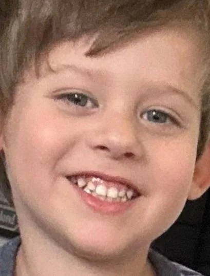 Original photograph of a smiling child used to create a custom LETSMAKIT portrait canvas.