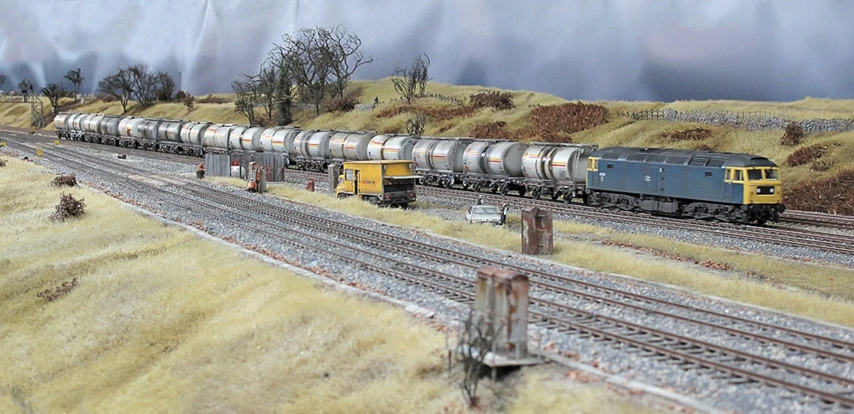 A photo of the junction itself showing a heavy fuel train diverting onto the Huddersfield line..