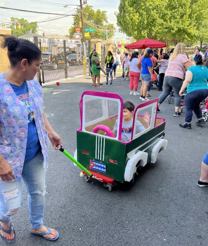 Staff and students take part in a neighborhood street event