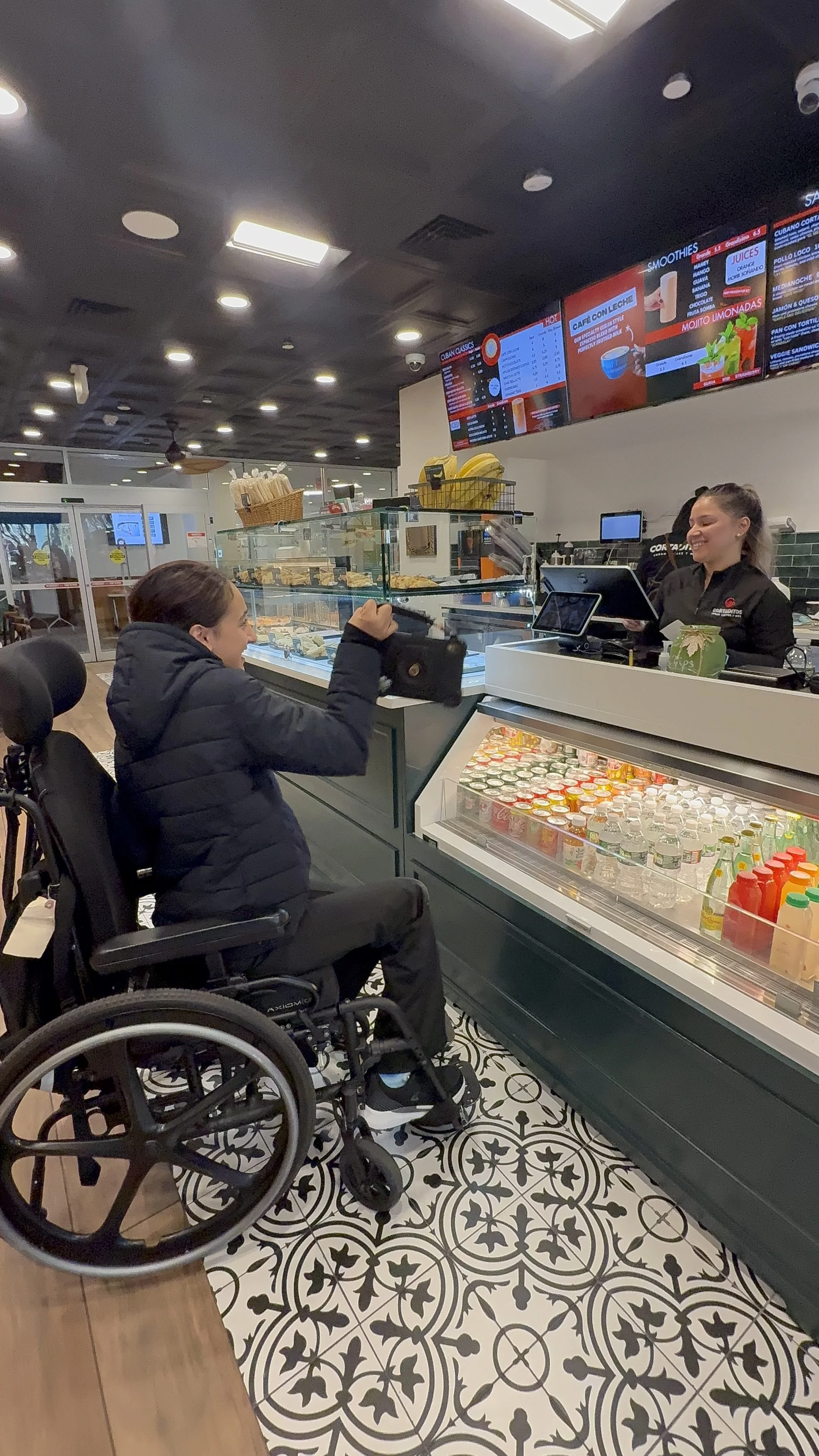 A student orders at a store counter during community-based instruction