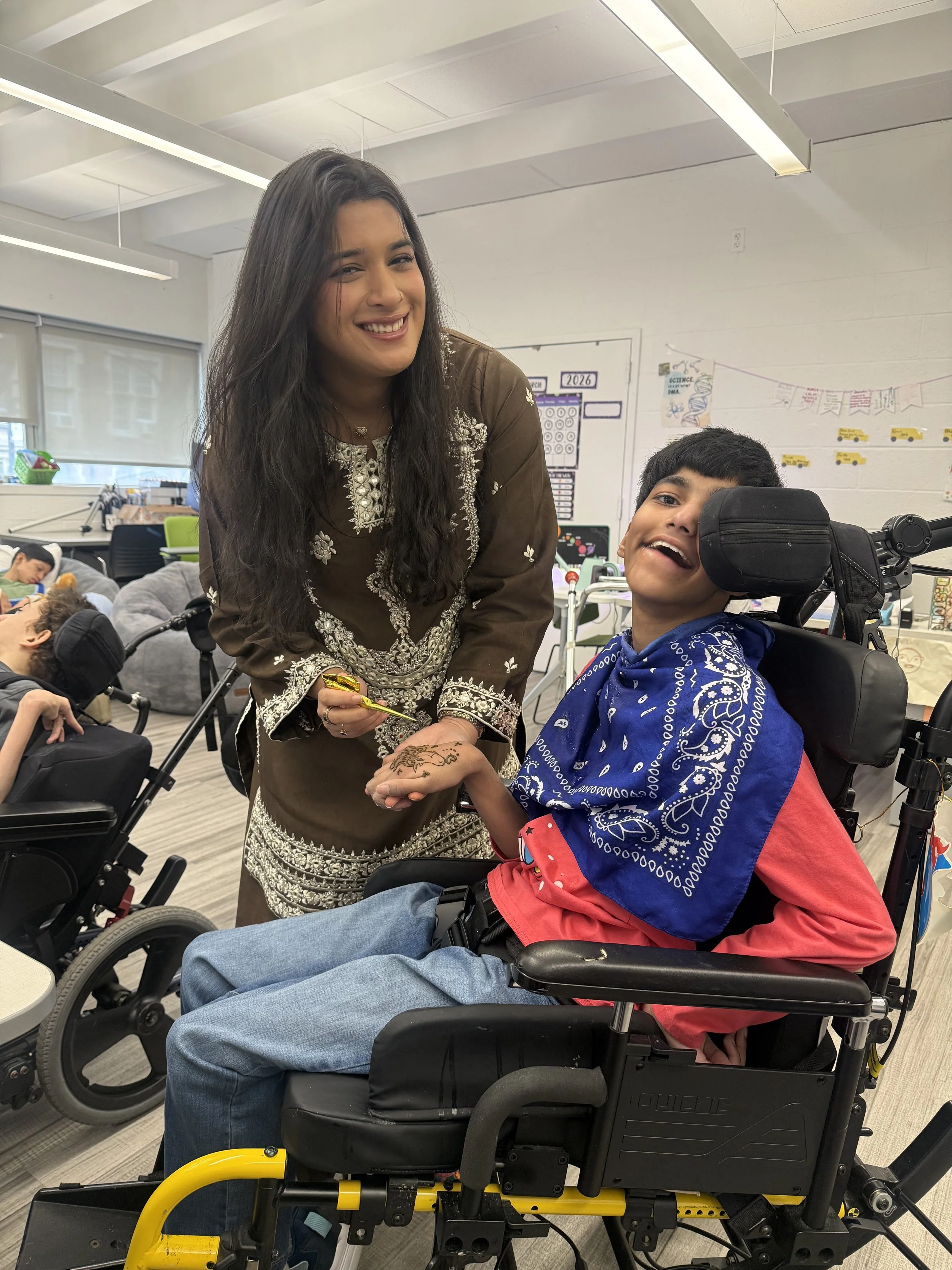 A therapist and a student work together in the classroom