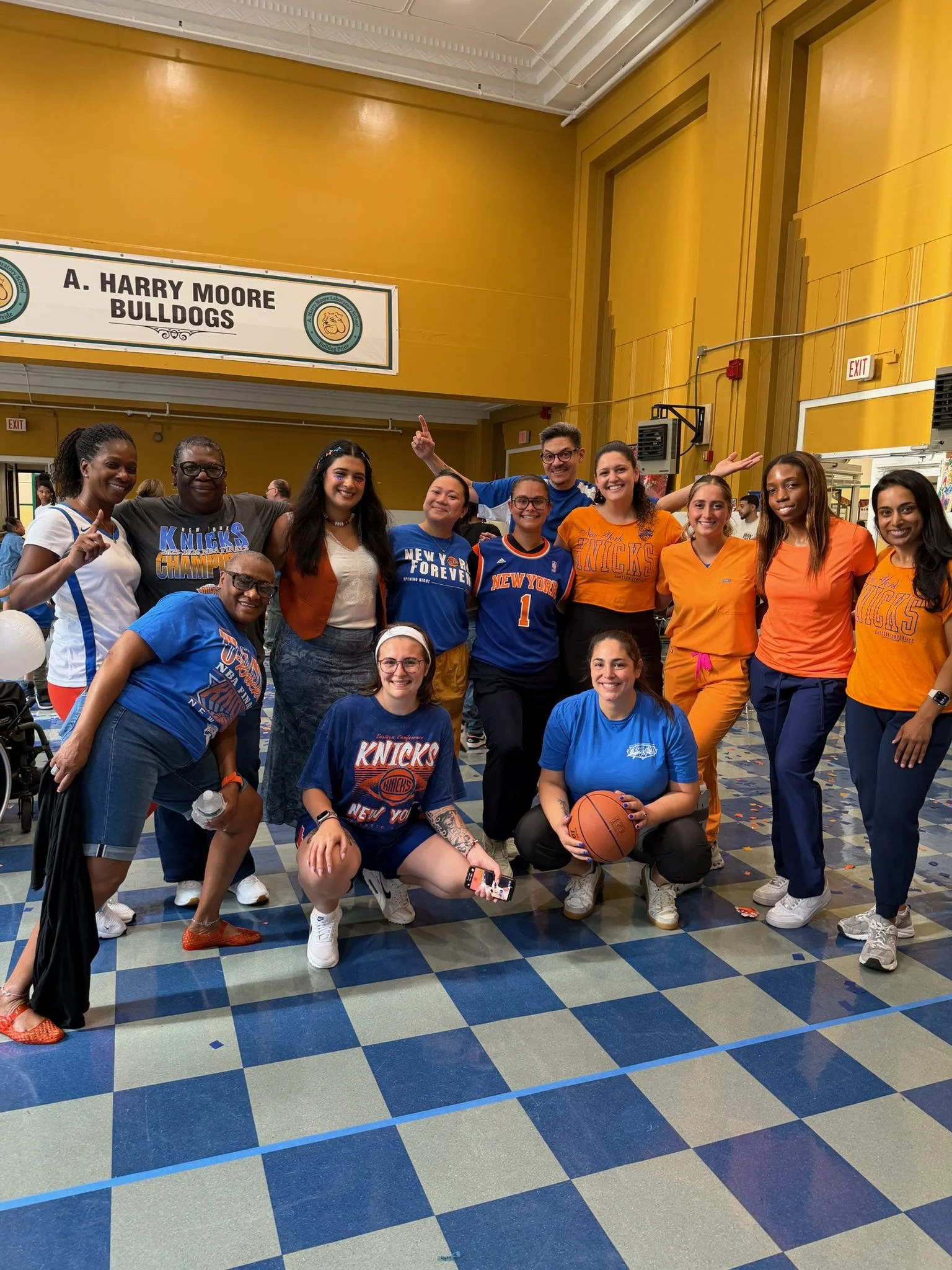 AHM students and staff in orange show their Bulldog spirit in the gym