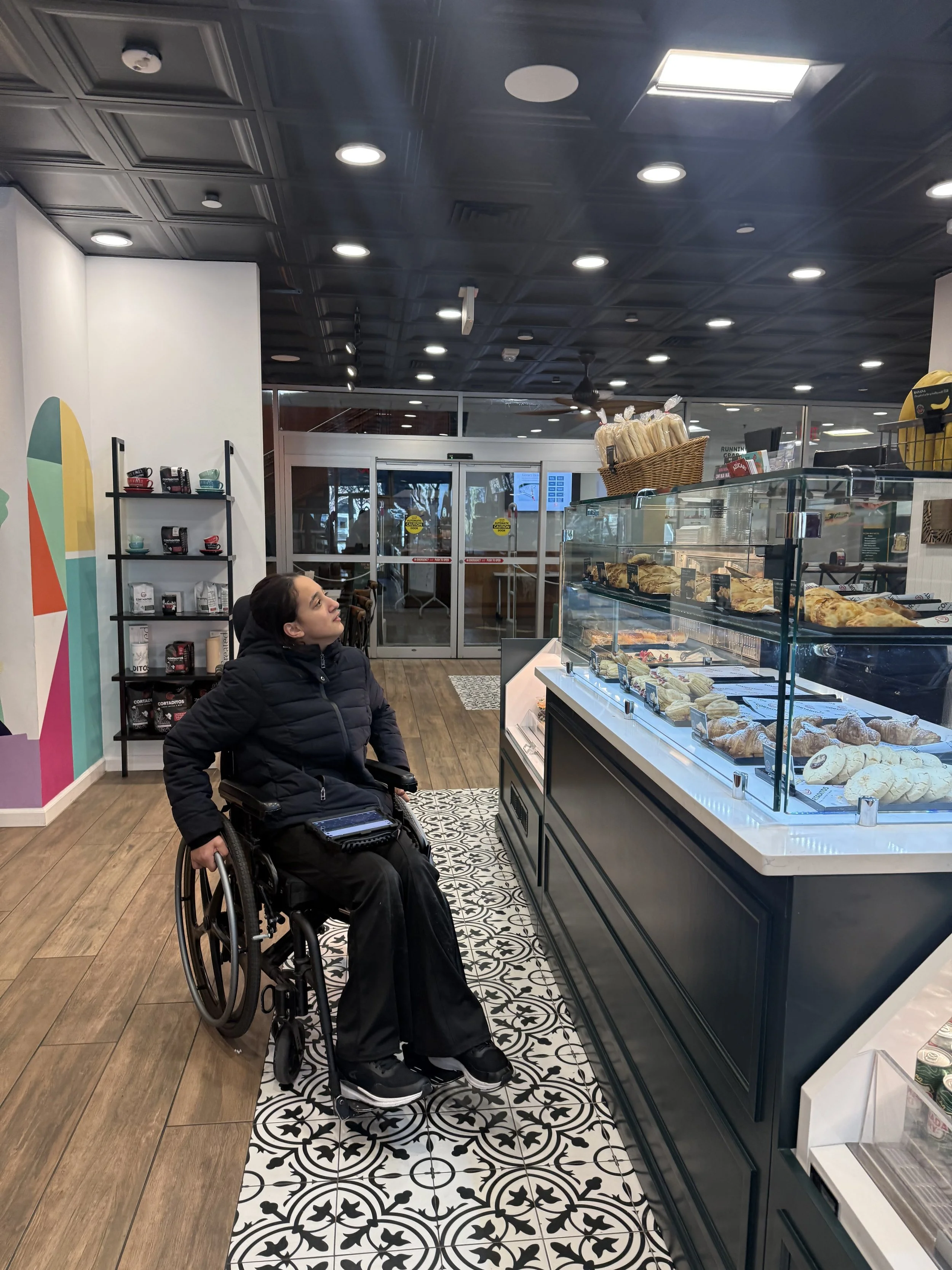A student who uses a wheelchair shops during community-based instruction
