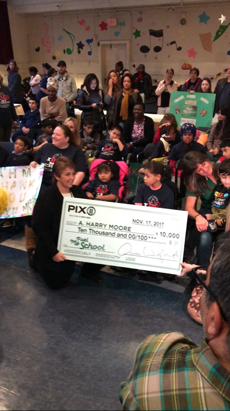 Students and staff with the PIX11 Fuel My School check, November 2017
