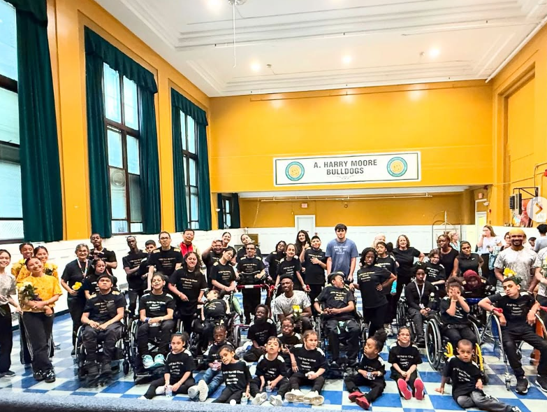 The whole school gathers for a group photo in the gym