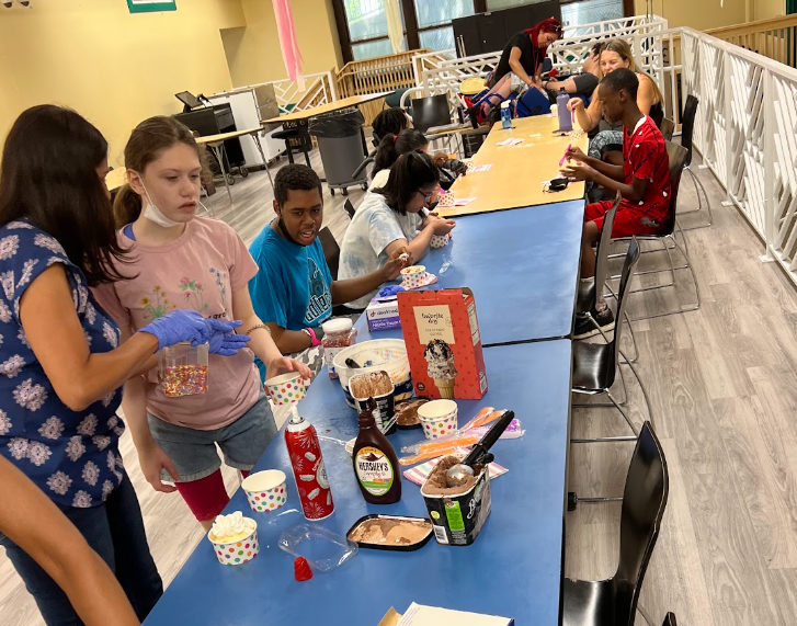 Students prepare food together during a cooking lesson