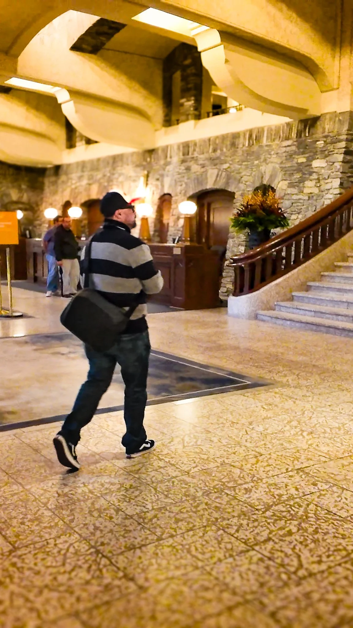 Christopher Canada walking in lobby.jpg