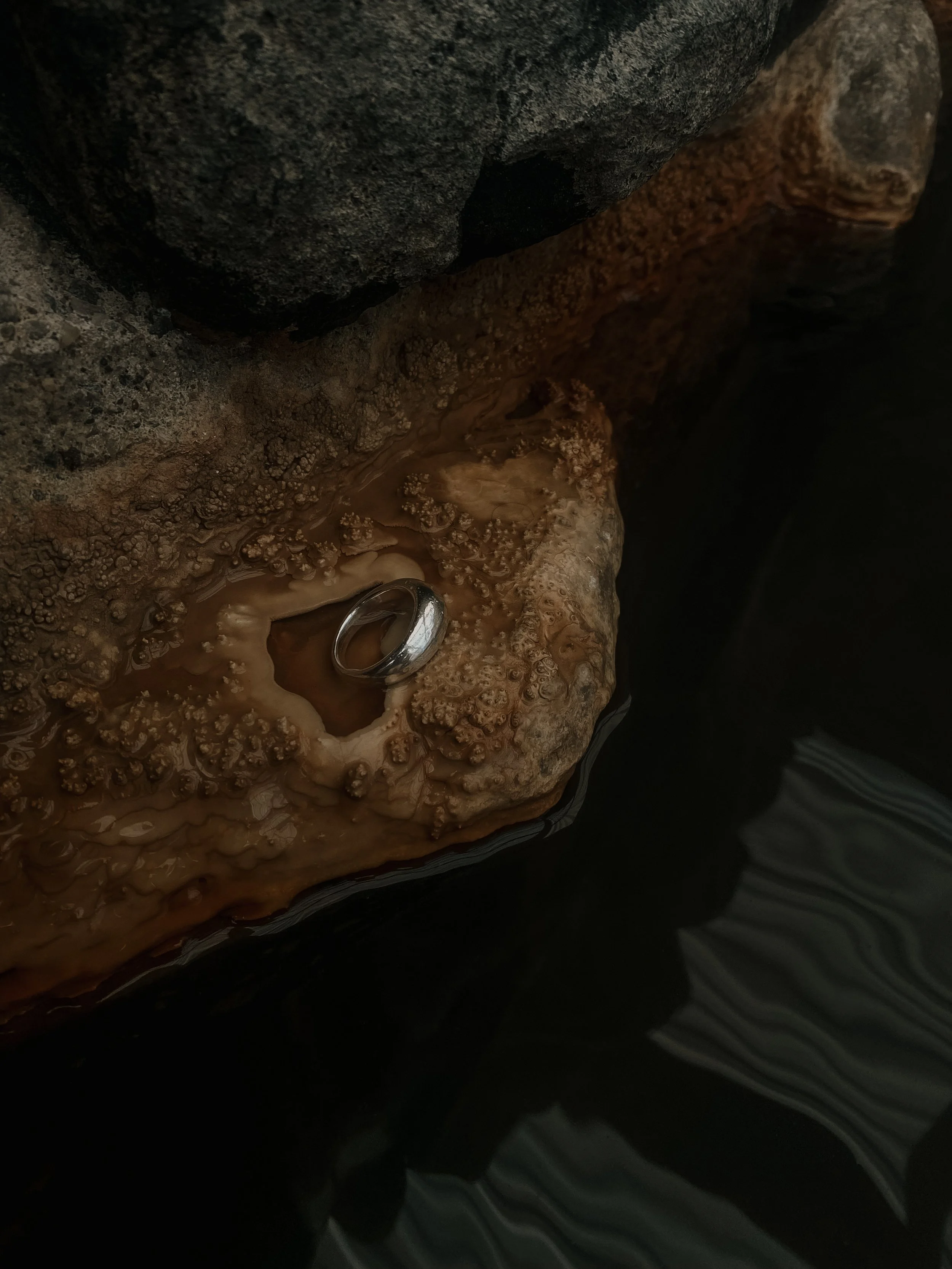 ring positioned on a rock