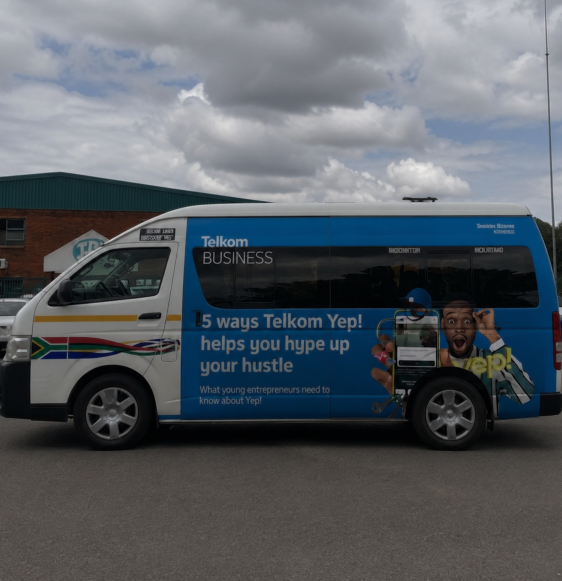 Commercial van with advertisement for Telkom Yep! highlighting 5 ways it helps young entrepreneurs hype up their hustle, featuring a young man with a surprised expression and a person holding a phone.