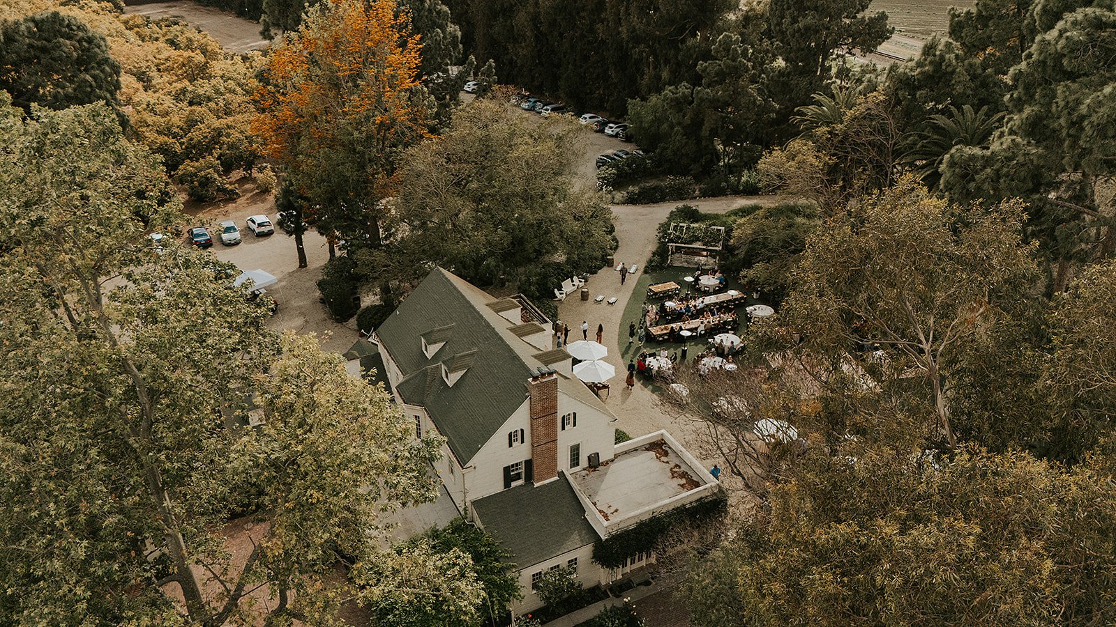 McCormick Home Ranch venue photographed from a drone in fall with colored leaves and a view of the grounds set up.