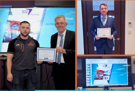 Three men in a room with conference screens, two of them holding framed certificates, one is standing in front of a large monitor displaying a presentation slide.