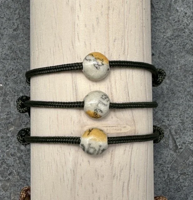 yellow dots on olive paracord
