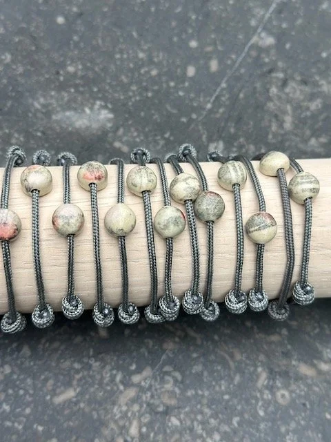 dots with pink or gray on charcoal paracord