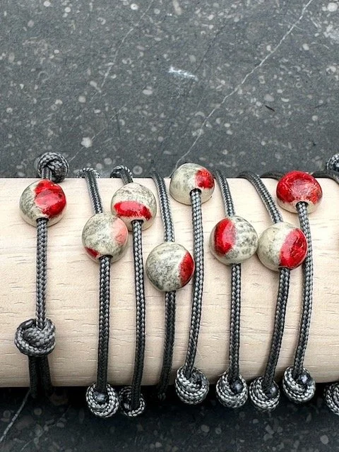 dots with red on charcoal paracord