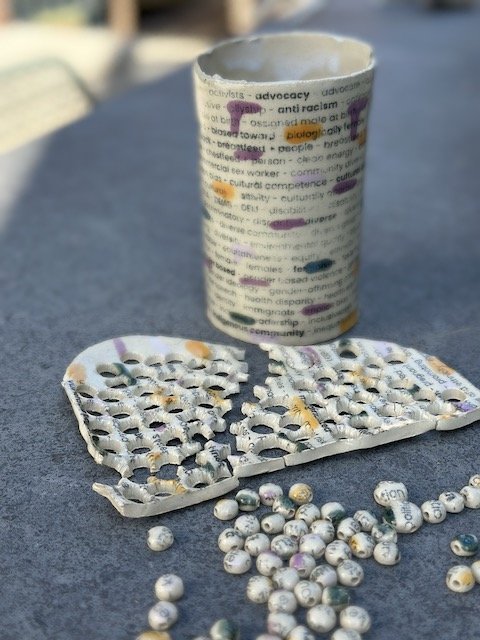 dots, skeleton and vase with the words