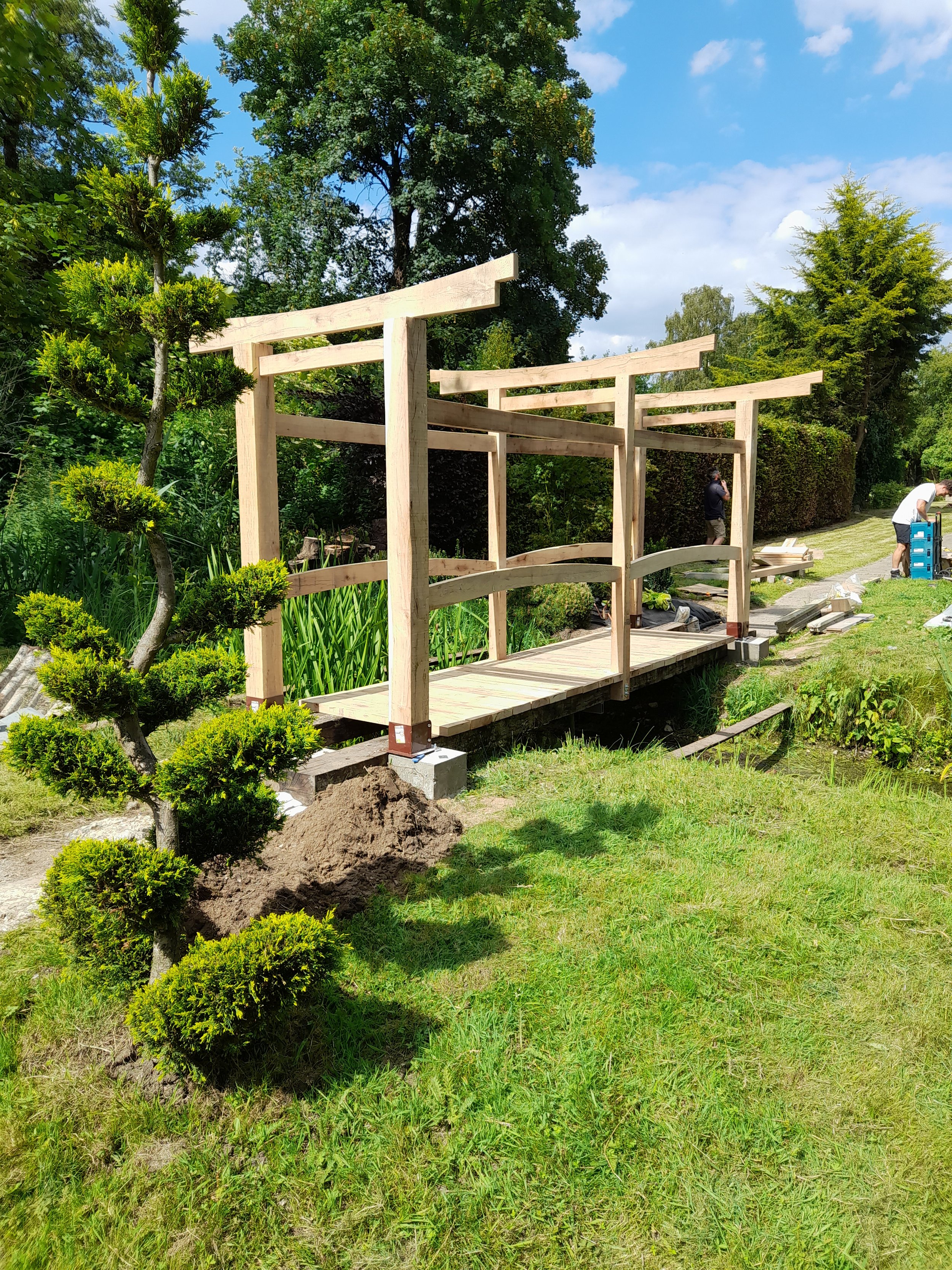 Bespoke oak Torii gate bridge handcrafted by GS Carpentry in North Norfolk.