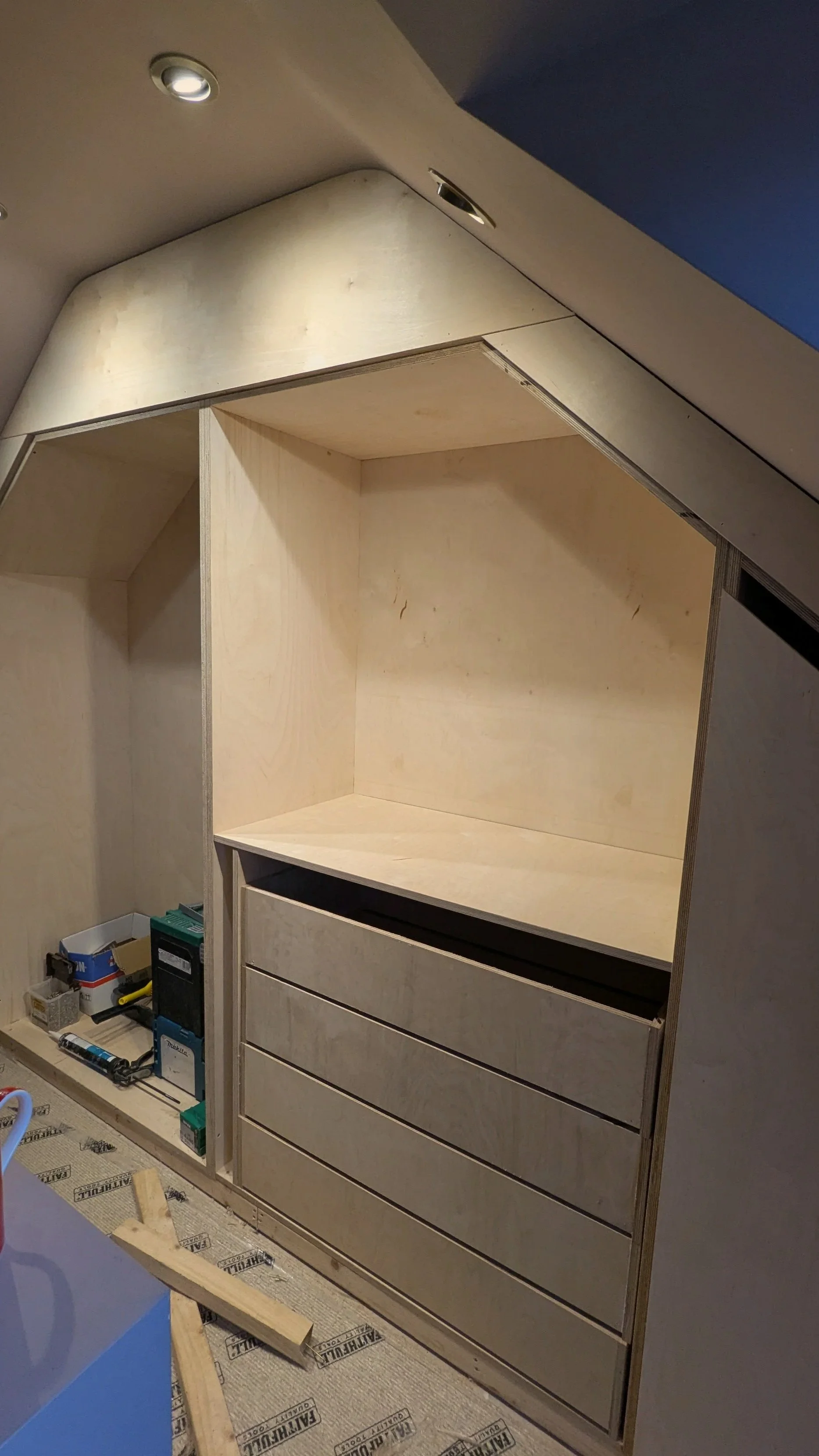 Mid-construction view of custom birch plywood wardrobe carcasses being installed by GS Carpentry.