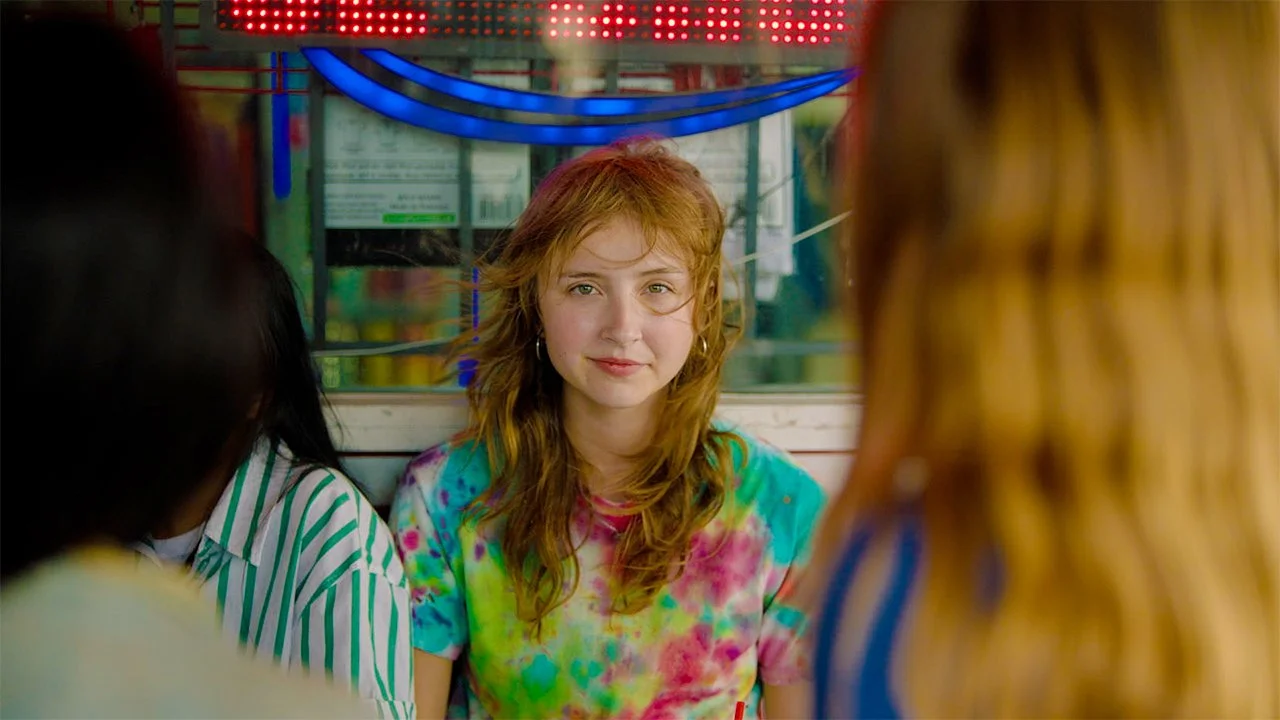 Girl smiling in tie-dye shirt