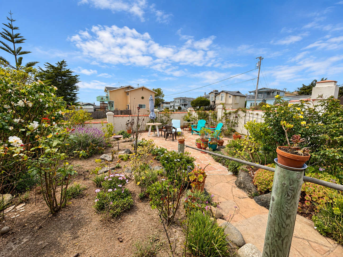 Edited photo of the landscaped garden and seating area at 380 Drake Street, Cambria