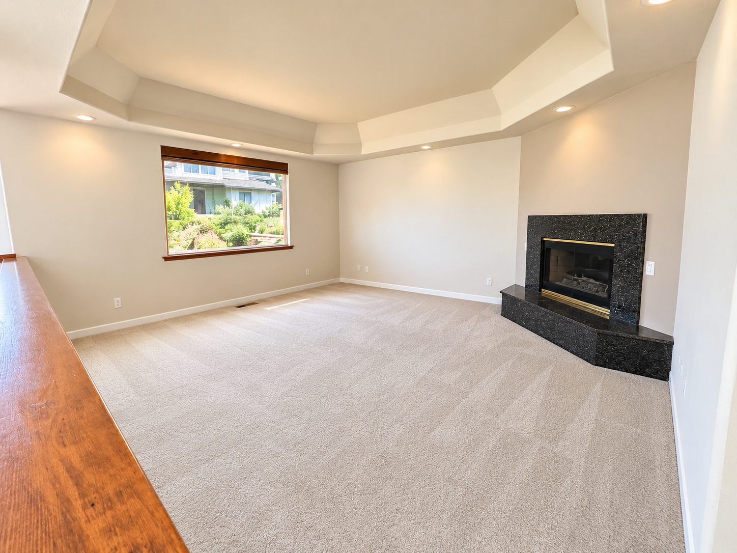 Edited photo of the living room and fireplace at 380 Drake Street, Cambria