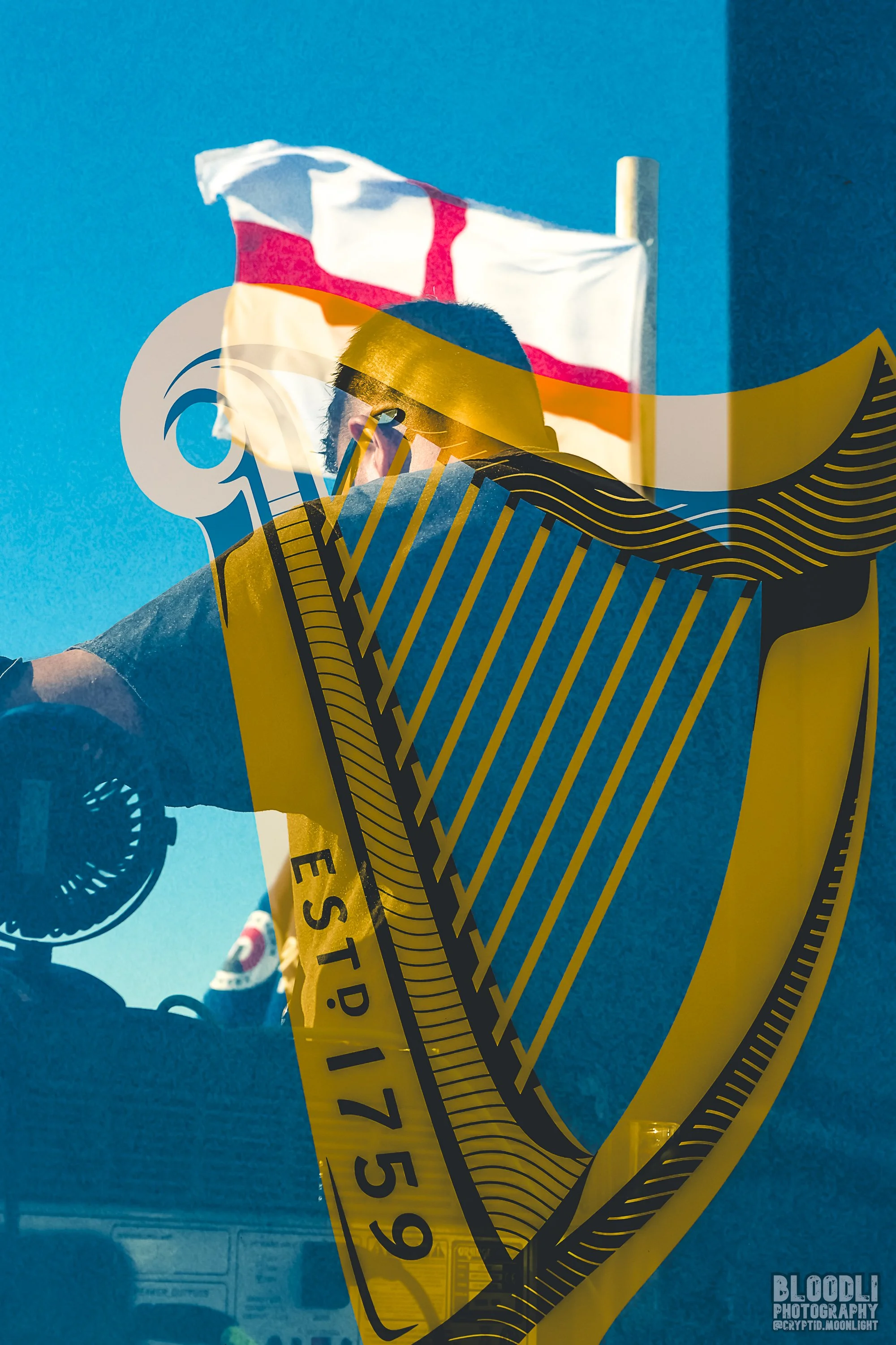 A person wearing glasses and a dark shirt is taking a photo of a red and white flag in front of a blue wall. Superimposed over the image is a yellow caution tape with black stripes and the words 'Police Line Do Not Cross' partially visible.