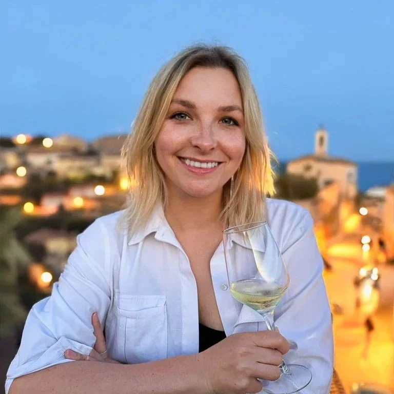 Anastasia Smanyuk, founder of Winetellect Projects, with a glass of white wine