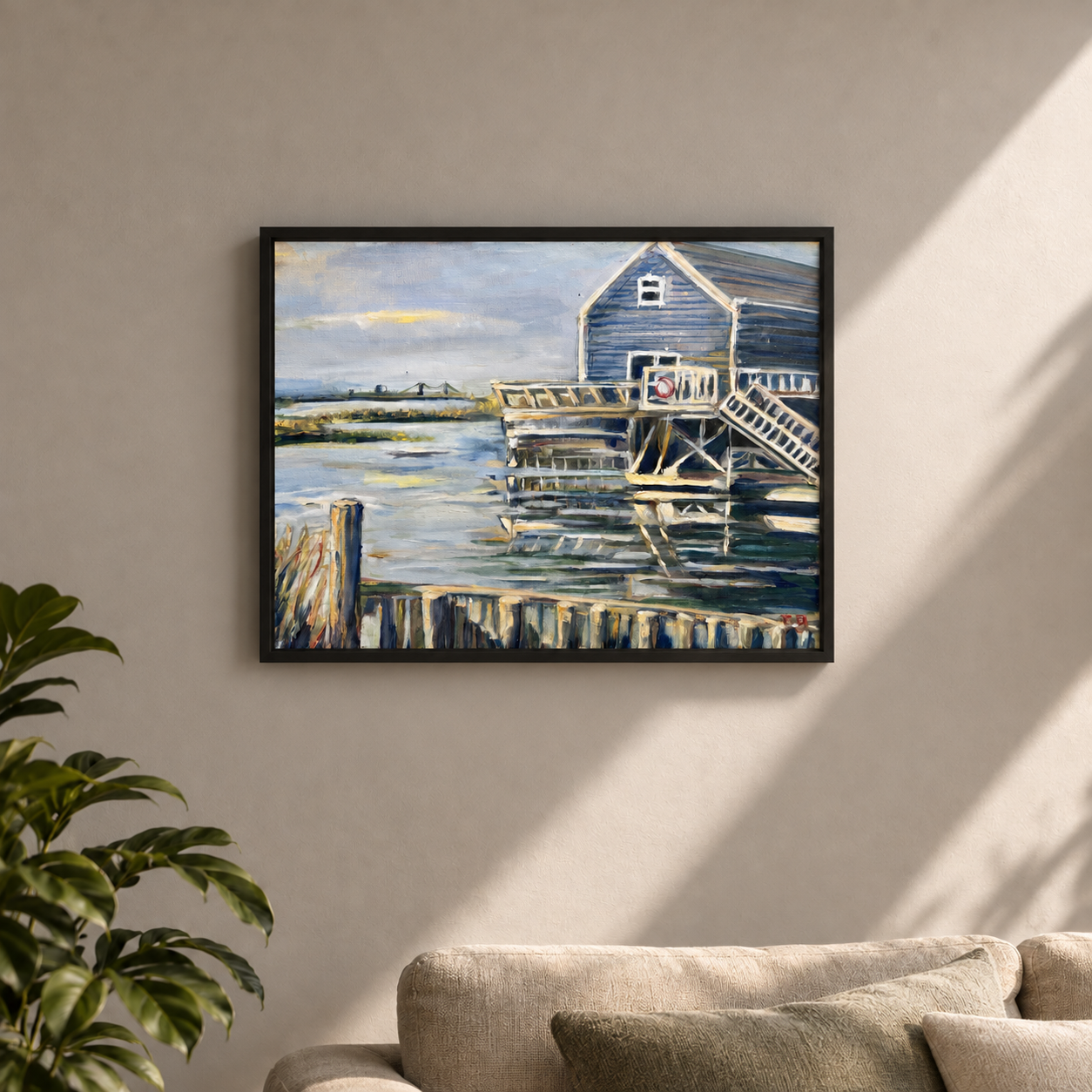 Framed landscape above the sofa.png