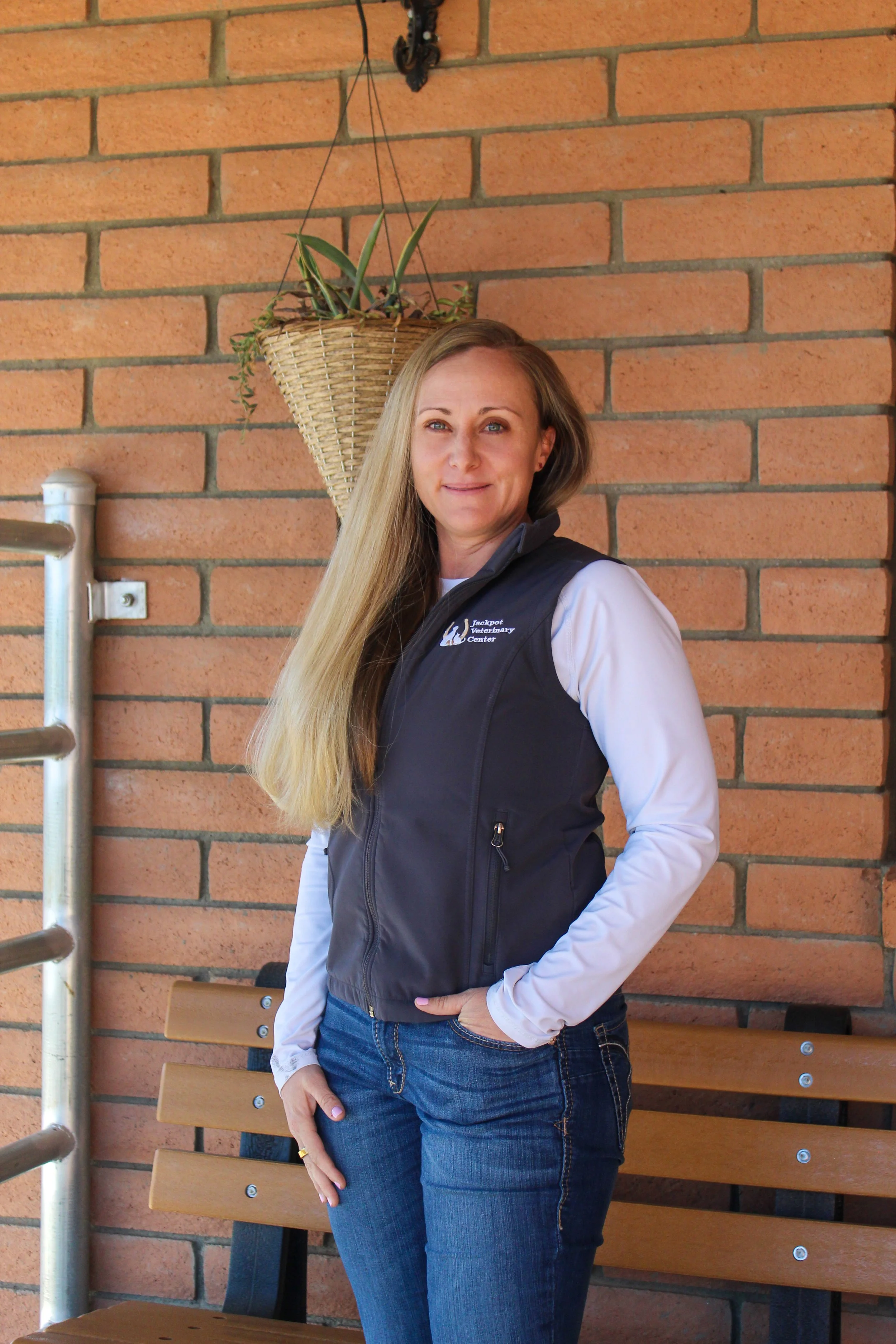 Women standing with brick background