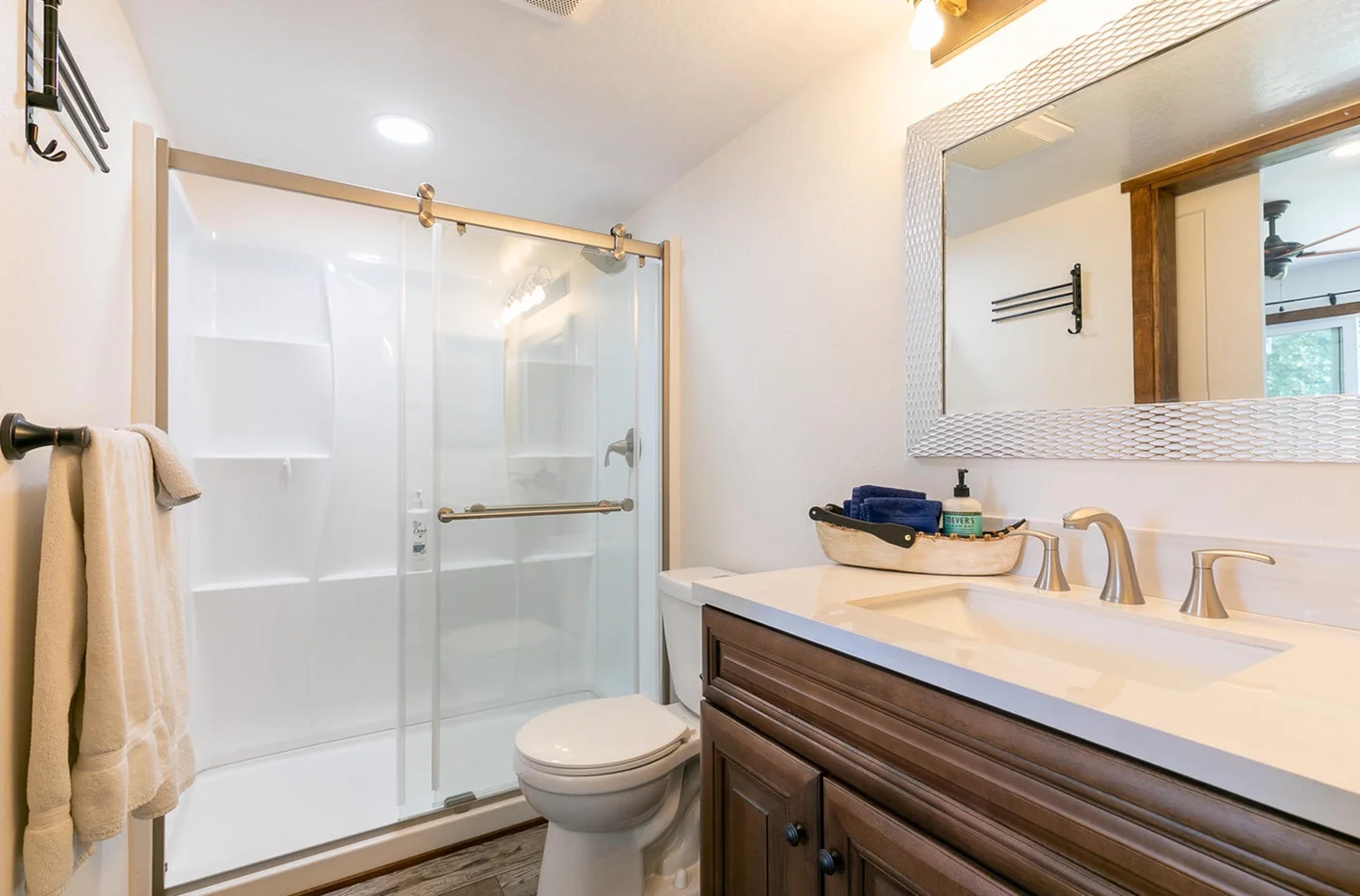 modern bathroom with glass shower and gold fixtures