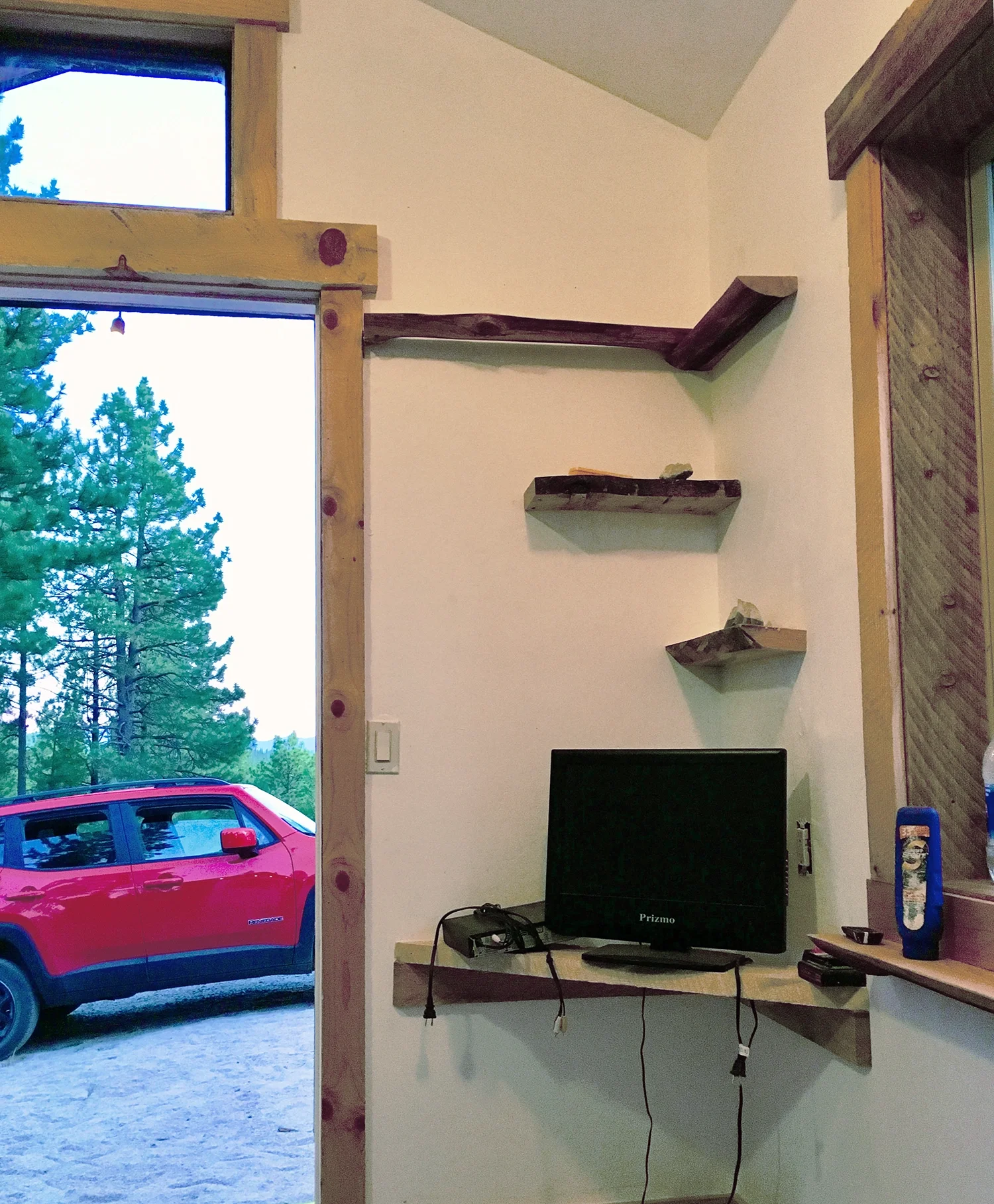 custom wood shelves for computer and wood trim around a door