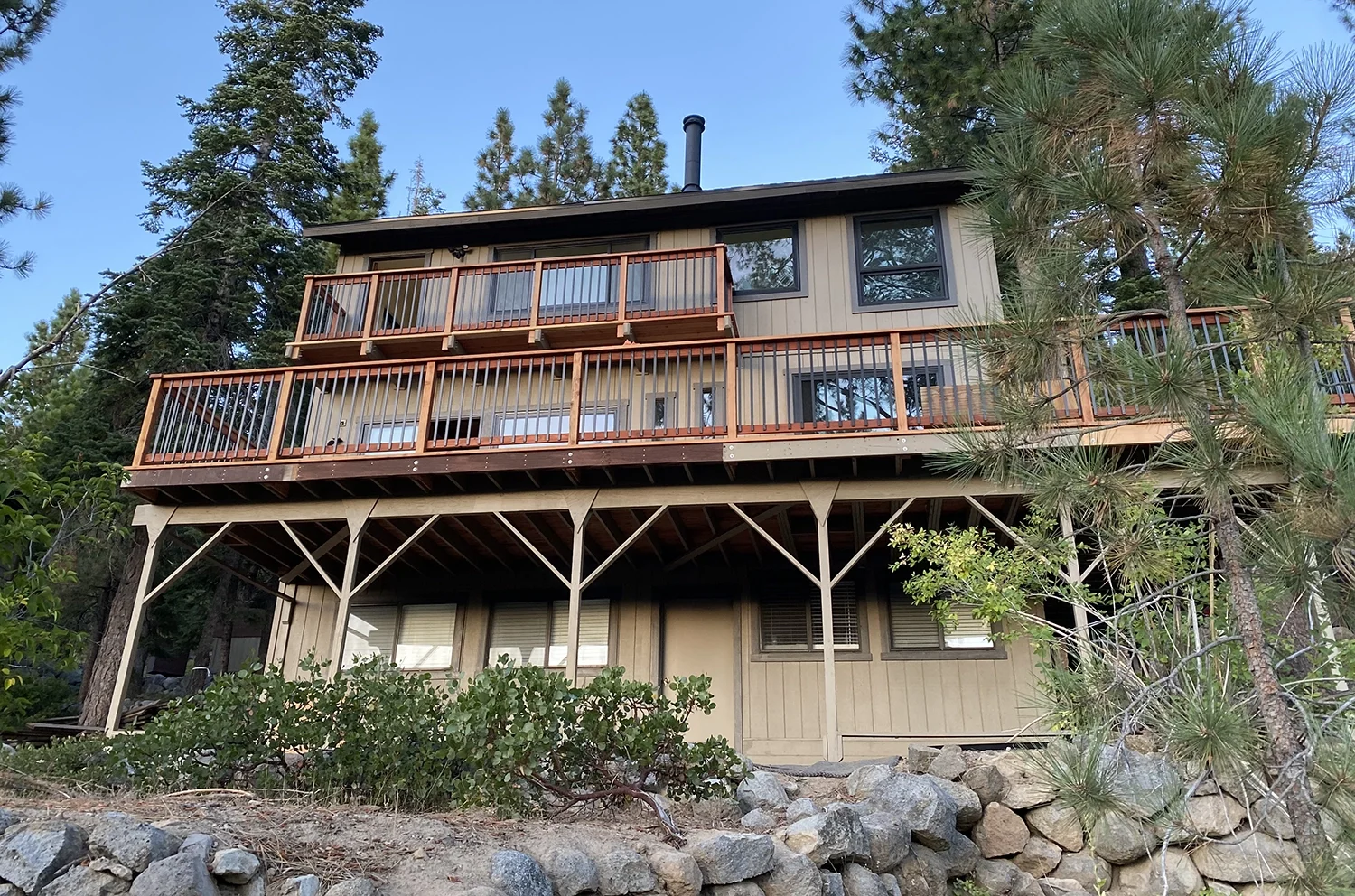 double decks on back of house on hillside
