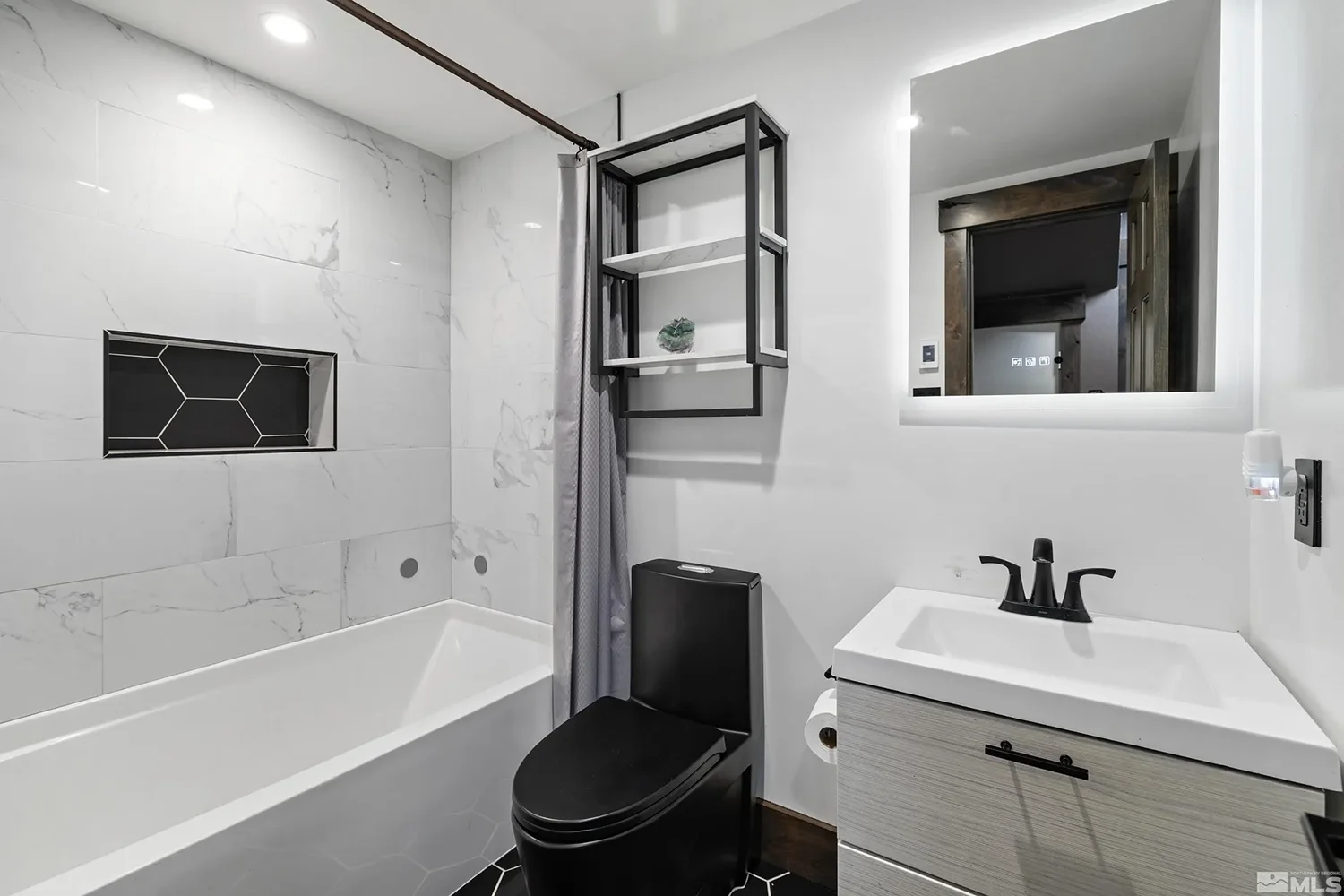 black and white bathroom with black toilet